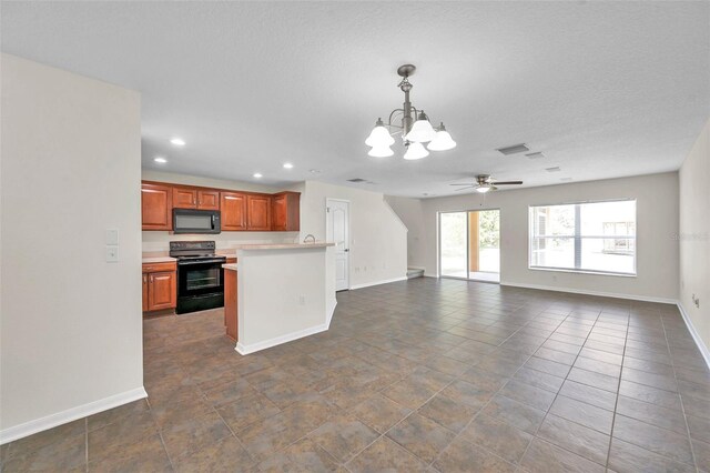 kitchen with light countertops, baseboards, black appliances, and recessed lighting