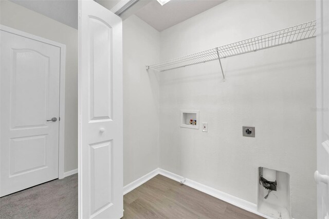laundry area with washer hookup, laundry area, electric dryer hookup, wood finished floors, and baseboards