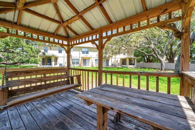 wooden deck featuring a gazebo, fence, and a yard