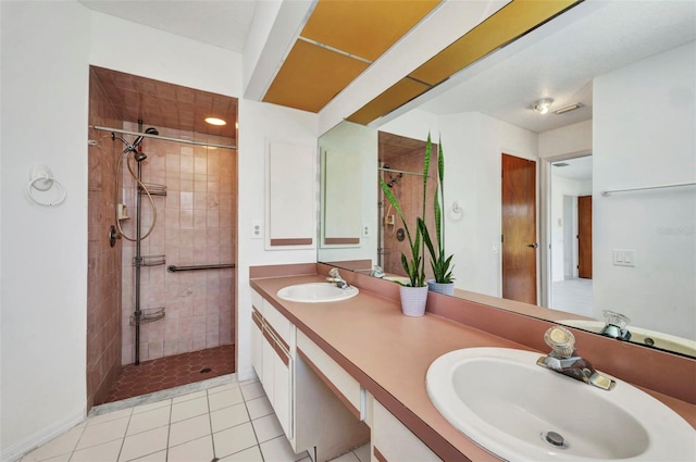 280 Fortaleza St, Punta Gorda, FL 33983 - bathroom with a tile shower, tile patterned flooring, and double vanity