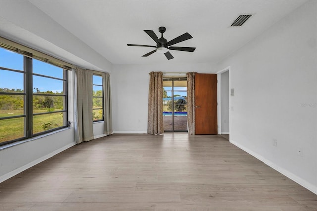 280 Fortaleza St, Punta Gorda, FL 33983 - spare room featuring light wood-style floors, a ceiling fan, and baseboards