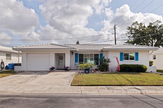 single story home with a garage, stucco siding, a front yard, and a tile roof