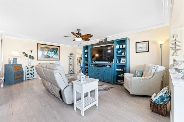 living room featuring ornamental molding and a ceiling fan