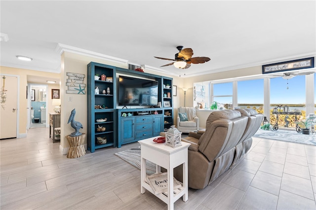 living area with crown molding and ceiling fan