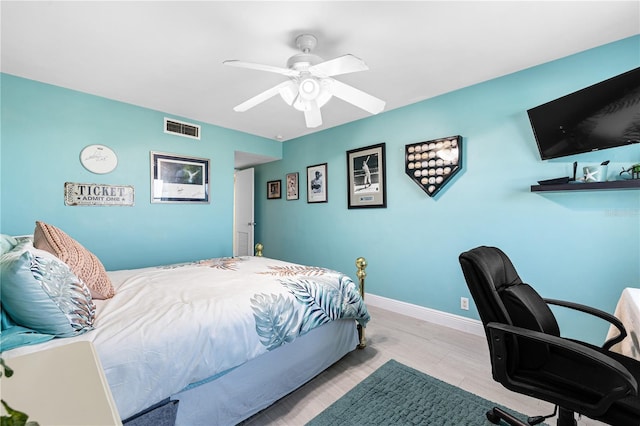 bedroom with baseboards, visible vents, and ceiling fan
