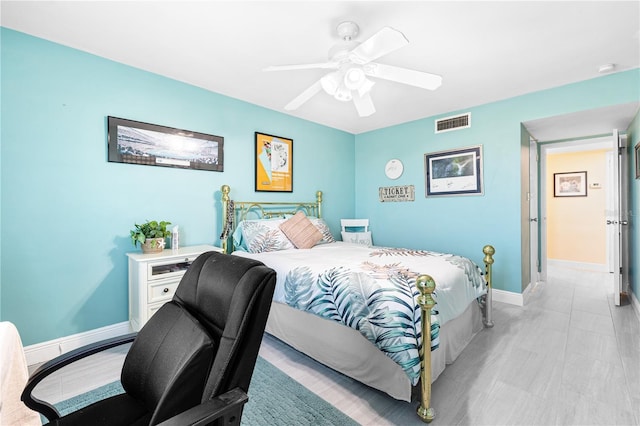 bedroom featuring baseboards, visible vents, and ceiling fan