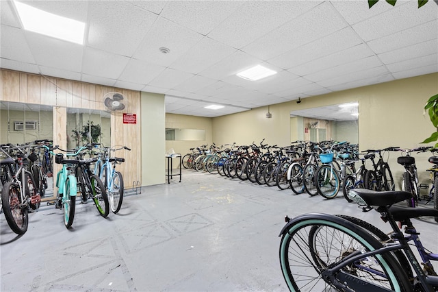 exercise room featuring a drop ceiling