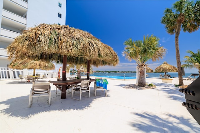 7200 Sunshine Skyway Ln S Unit 4B, Saint Petersburg, FL 33711 - community pool featuring a water view and a patio area