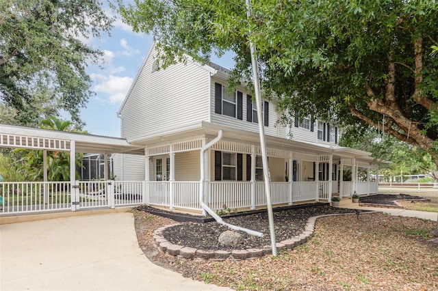 country-style home featuring a porch