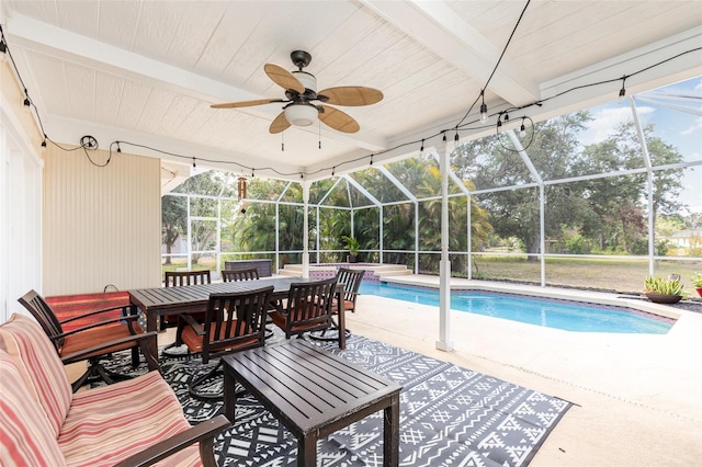 pool featuring a lanai, a patio, and a ceiling fan