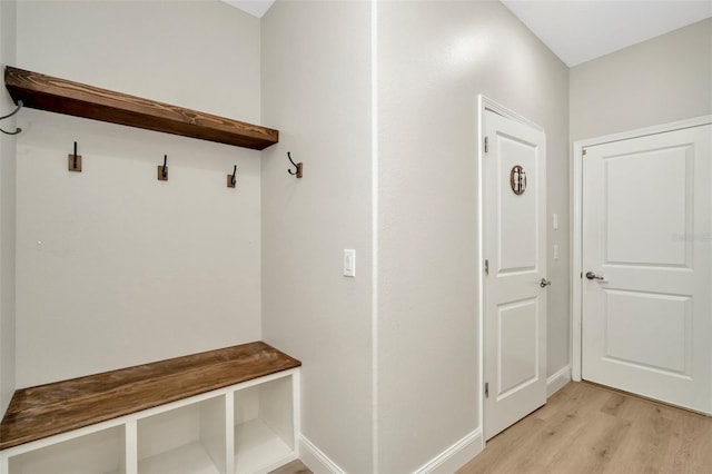 mudroom with baseboards and light wood-type flooring