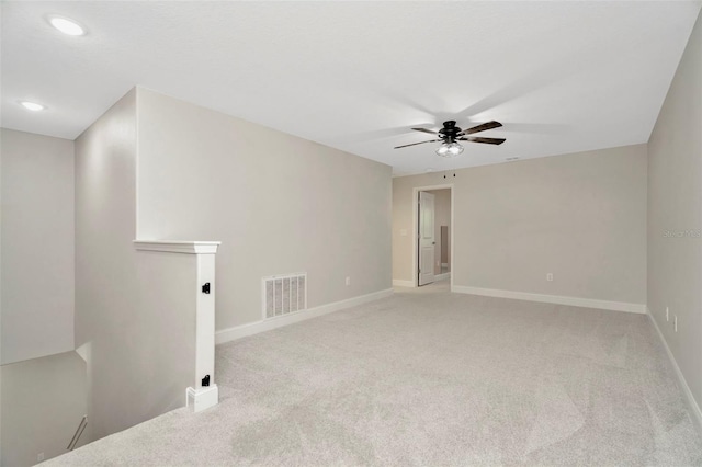 carpeted empty room with recessed lighting, ceiling fan, visible vents, and baseboards