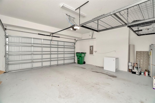 garage featuring a garage door opener, electric panel, and refrigerator