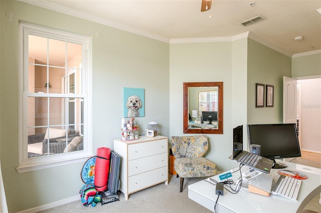 carpeted office featuring baseboards, ornamental molding, ceiling fan, and visible vents