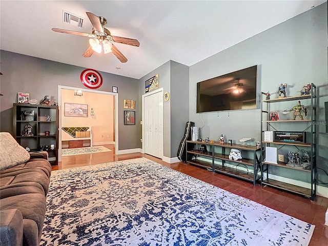 16224 Iola Woods Trl, Dade City, FL 33523 - living room featuring baseboards, ceiling fan, visible vents, and wood finished floors