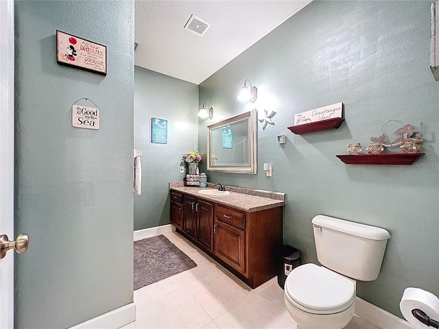 16224 Iola Woods Trl, Dade City, FL 33523 - bathroom featuring vanity, tile patterned flooring, toilet, and visible vents