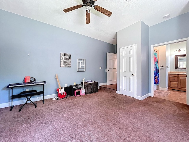 16224 Iola Woods Trl, Dade City, FL 33523 - interior space with baseboards, a ceiling fan, a textured ceiling, and light colored carpet