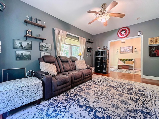 16224 Iola Woods Trl, Dade City, FL 33523 - living room featuring baseboards, ceiling fan, and wood finished floors