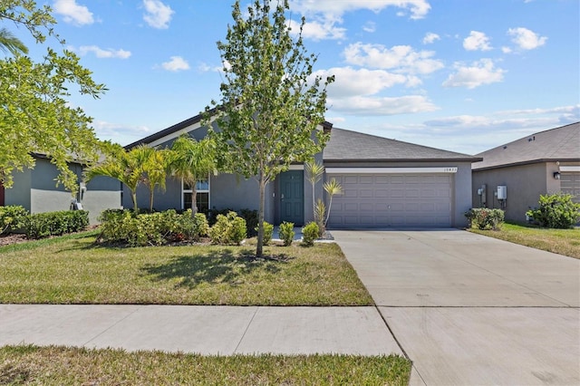 view of front of house with concrete driveway, an attached garage, stucco siding, and a front lawn