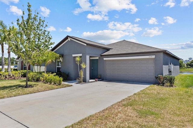 single story home with an attached garage, stucco siding, driveway, and a front yard
