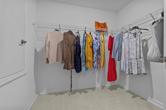 spacious closet with tile patterned floors