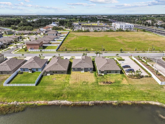 aerial view featuring a residential view and a water view