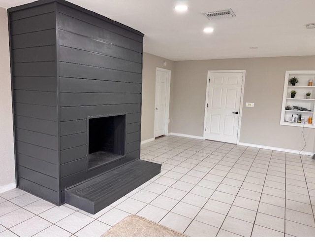unfurnished living room featuring visible vents, a fireplace, light tile patterned floors, baseboards, and recessed lighting