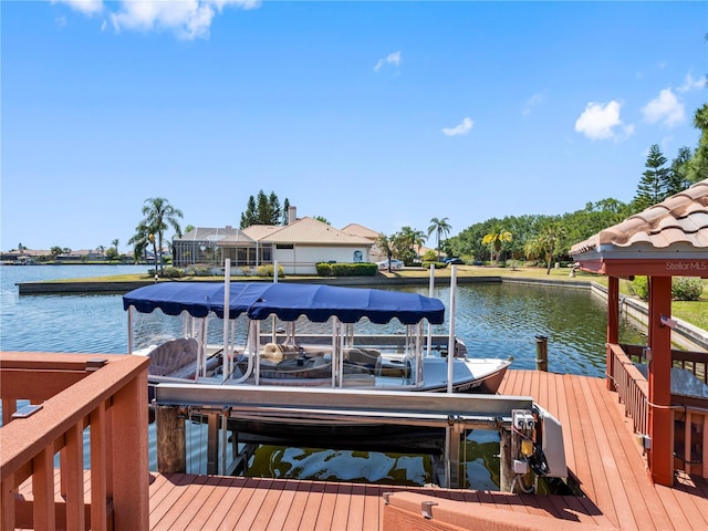 dock area with a water view and boat lift