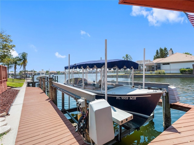 dock area featuring a water view and boat lift