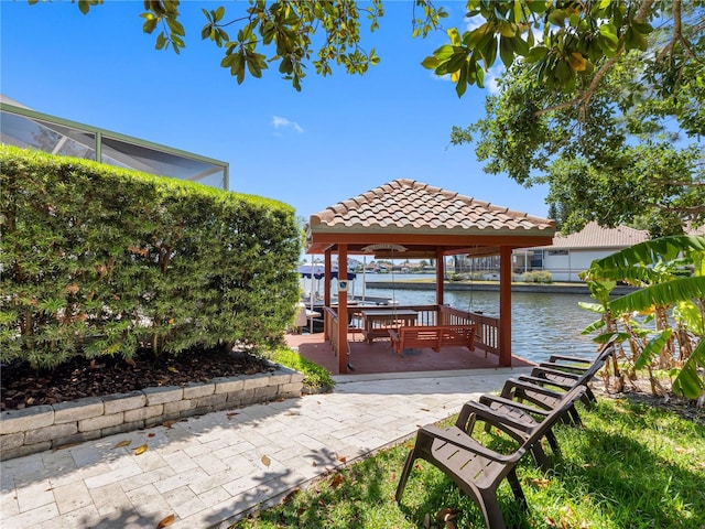 view of dock with a water view and a gazebo