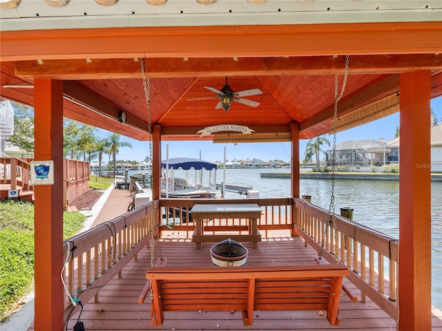 dock area featuring boat lift, a water view, and a gazebo