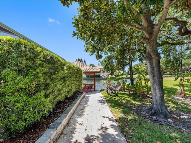 view of yard featuring a water view and a gazebo