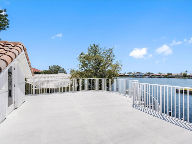 view of patio featuring a water view