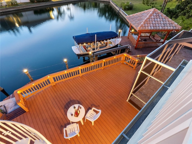 view of dock with a water view and boat lift