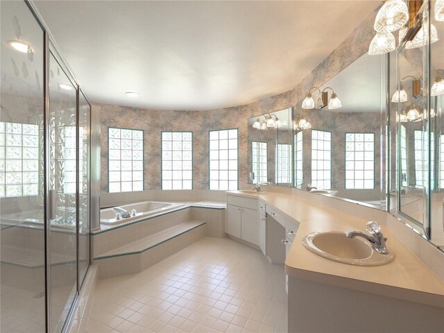 bathroom with tile patterned floors, plenty of natural light, and a sink