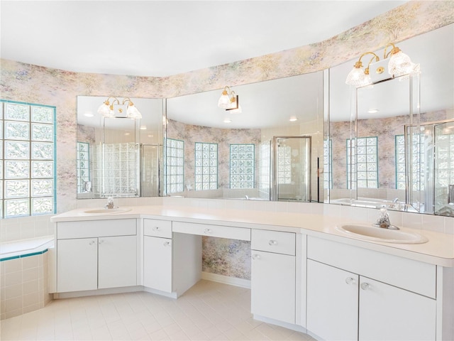 full bathroom with a stall shower, vanity, plenty of natural light, and tile patterned floors