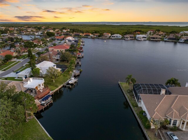 drone / aerial view with a water view and a residential view