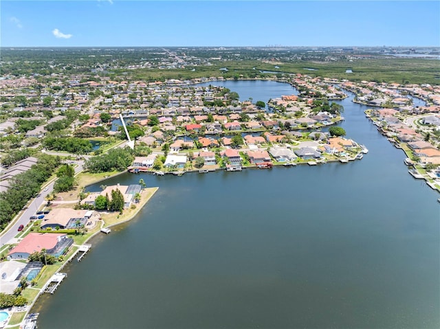 birds eye view of property featuring a water view and a residential view