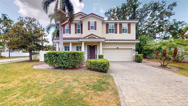 3615 S Church Ave, Tampa, FL 33629 - traditional home with a garage, stucco siding, decorative driveway, a front yard, and a tiled roof