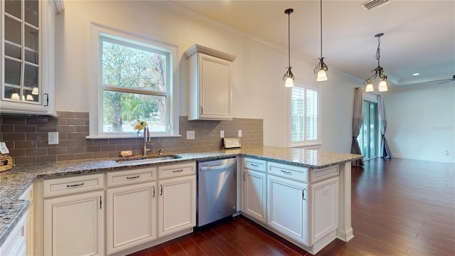 3615 S Church Ave, Tampa, FL 33629 - kitchen featuring dishwasher, a sink, a peninsula, crown molding, and decorative backsplash