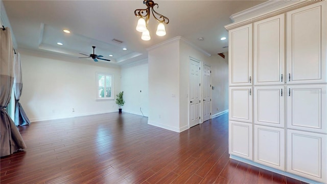 3615 S Church Ave, Tampa, FL 33629 - unfurnished room with ceiling fan, baseboards, a tray ceiling, dark wood-style flooring, and crown molding