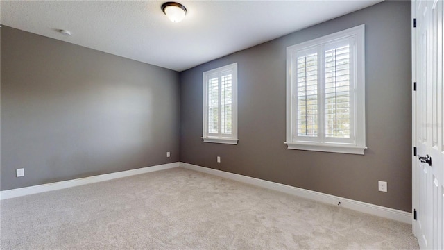 3615 S Church Ave, Tampa, FL 33629 - empty room featuring carpet floors, baseboards, and a smoke detector