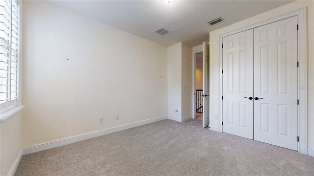 3615 S Church Ave, Tampa, FL 33629 - unfurnished bedroom with light carpet, a closet, and baseboards