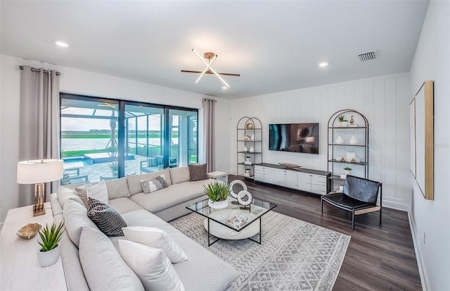 5949 Bluestar Ct, Lakewood Ranch, FL 34211 - living area featuring recessed lighting, baseboards, visible vents, and dark wood-type flooring