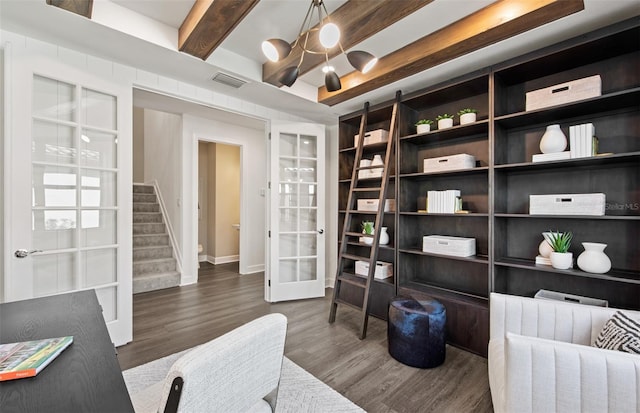 5949 Bluestar Ct, Lakewood Ranch, FL 34211 - sitting room with french doors, visible vents, wood finished floors, beamed ceiling, and an inviting chandelier