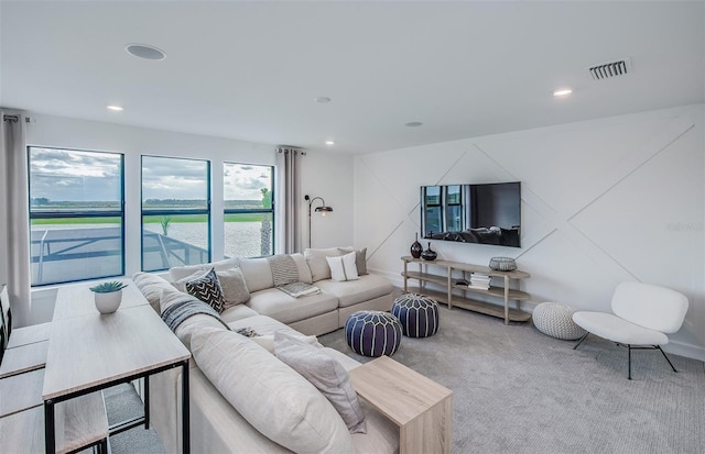 5949 Bluestar Ct, Lakewood Ranch, FL 34211 - carpeted living area featuring visible vents and recessed lighting