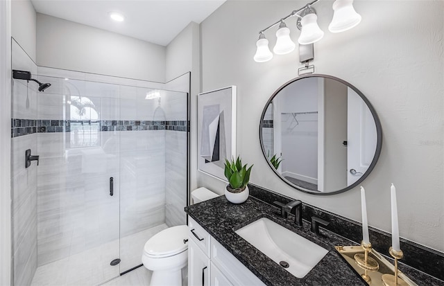 5949 Bluestar Ct, Lakewood Ranch, FL 34211 - bathroom featuring vanity, a shower stall, and toilet