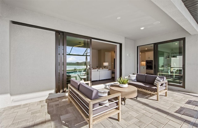 5949 Bluestar Ct, Lakewood Ranch, FL 34211 - view of patio featuring a water view and outdoor lounge area