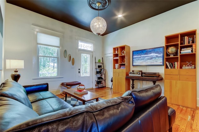 6341 Discovery Ln, Land O Lakes, FL 34638 - living area with light wood-style flooring and a chandelier