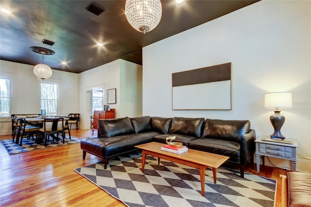 6341 Discovery Ln, Land O Lakes, FL 34638 - living area featuring light wood finished floors and a chandelier
